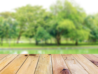 Empty top wooden table and blurred green nature background. For present your products display