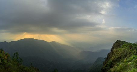 Panorama light beam from the clouds rain is beautiful. Opposite on the other side of the sky bright. Khao San Nok Wua at Kanchanaburi Province, Thailand. subject is blurred.