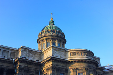 Kazan Cathedral in St. Petersburg, Russia. Orthodox Church Built in 1811 by the Russian Architect Voronikhin. Building Close Up with Dome and Stone Colonnade on Empty Blue Sky Background on Sunny Day.