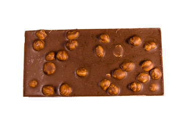 Dark chocolate with hazelnuts isolated on a white background