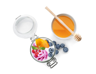 Fototapeta na wymiar Yogurt with fruits in jar and bowl of honey on white background
