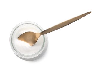 Jar with tasty yogurt and spoon on white background