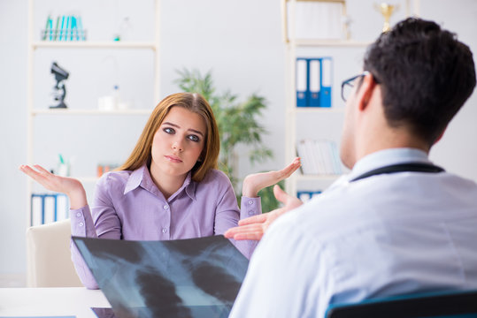 Doctor examining x-ray images of patient