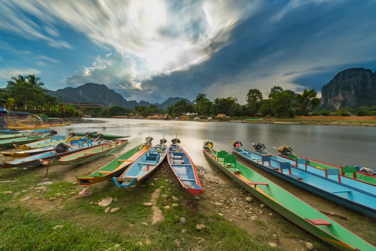 Long exposure and long tail boats on naw song river in Vang vieng, Laos.