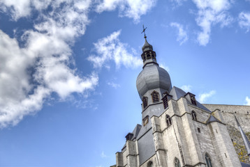Closeup of the tower section of the big cathedral at Dinant Belgium. A popular travel destination for tourists.