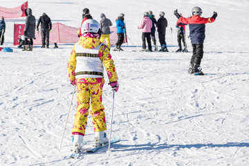 People are having fun in downhill skiing and snowboarding	