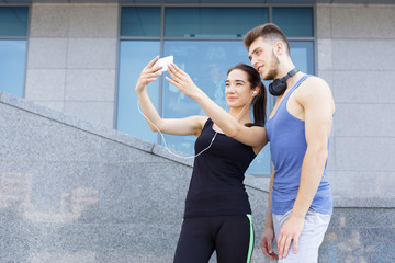 Man and woman runner making selfie