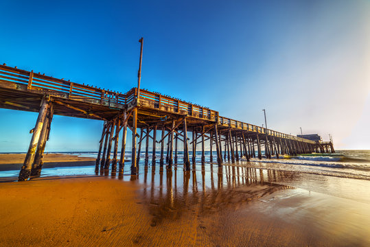 Newport Beach wooden pier at sunset