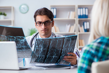 Doctor examining x-ray images of patient