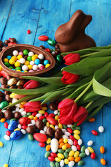 Chocolate Easter eggs and bunny with fresh easter flower