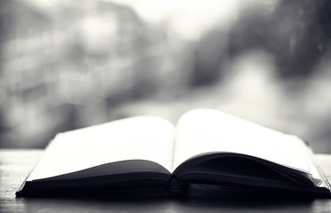 open book and a table black and white