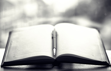 open book and a table black and white