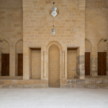 Public Mosque attached to Al-Muayyedi Bimaristan historic building, with Mihrab (niche) engraved in bricks stone wall, Darb Al Labana district, Old Cairo, Egypt