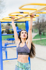 a young girl goes in for sports in the fresh air . Sports clothing pink color