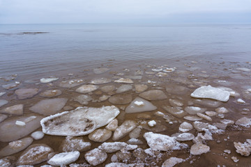 Frozen ice crystals on the sea beach