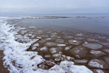 Frozen ice crystals on the sea beach