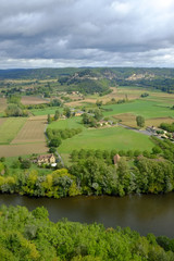 Fototapeta na wymiar Late summer view over patchwork fields and river of the Dordogne valley near Castelnaud-la-Chapelle, Aquitane, France