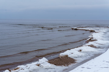 Frozen ice crystals on the sea beach