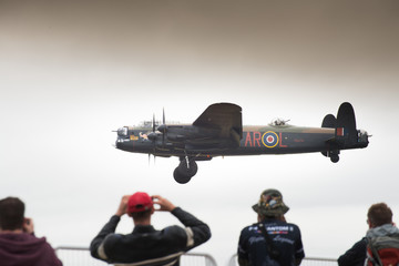Lancaster bomber coming into land at air show - obrazy, fototapety, plakaty