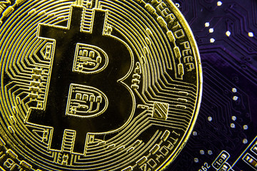 Cryptocurrency Bitcoin On The Motherboard. Gold Coin. Virtual Currency.