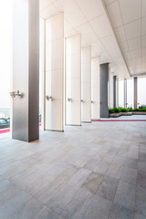 interior of modern office, Abstract Background. Store, interior, office, elegant stools and table in huge and bright hall, Resting area of a building, wide space in a building.