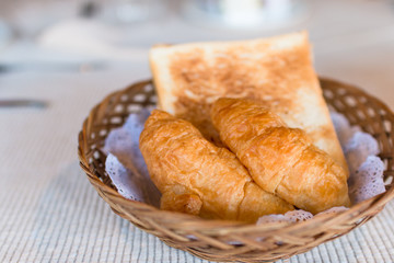 Fresh baked croissants on breakfast table. Food concept, Breakfast in hotel