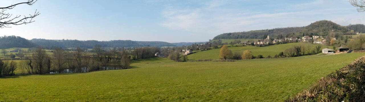 Picturesque Uley village on the edge of the Cotswold Hills escarpment in spring sunshine, Gloucestershire, UK.