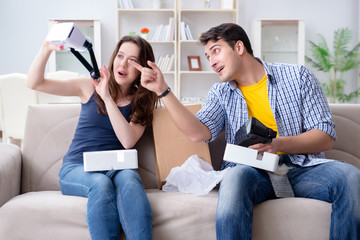 Young family playing games with virtual reality glasses