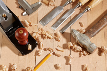 .DIY concept. Woodworking and crafts tools. Carpentry hand tools on a workbench. Planers, chisels,...