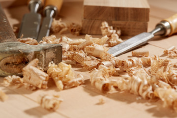 DIY concept. Woodworking and crafts tools. Carpentry hand tools on a workbench. Chisels, hammer,...