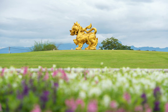 building in garden with bllur flower foreground in singha park , Chiang rai , northern of Thailand