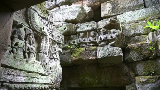 zoom out shot of a carved lintel at the ruins of preah khan temple near angkor wat, cambodia