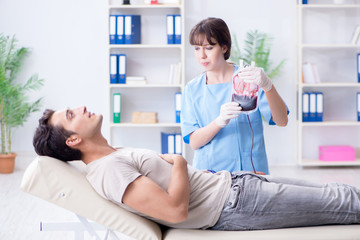 Patient getting blood transfusion in hospital clinic