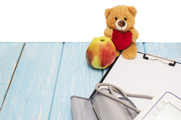 Medical apparatus for measuring blood pressure in the background bear with a heart. Children's...