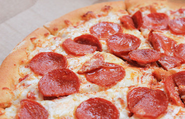 Pepperoni Italian Pizza Close Up View. Traditional Pizza Pie with Pepperoni, Salami, Cheese and Tomato Sauce Toppings. Freshly Baked Hot Product, Homemade Hot Pizza, Fast Food Meal Option.