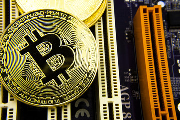 Fototapeta na wymiar Cryptocurrency Bitcoin On The Motherboard. Gold Coin. Virtual Currency.