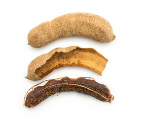 Compare tamarind top view isolated on white background Indian dates in a brittle shell, hollow shell and brown jelly flesh.