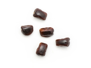 Five tamarind seeds top view isolated on white background Indian dates.