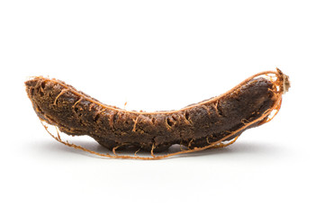 Fototapeta premium Open tamarind brown jelly flesh isolated on white background one Indian date without shell.
