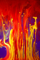Abstract painting of gouache paints, forming swirly, flashy, turning patterns 