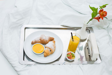 croissants with honey and orange juice