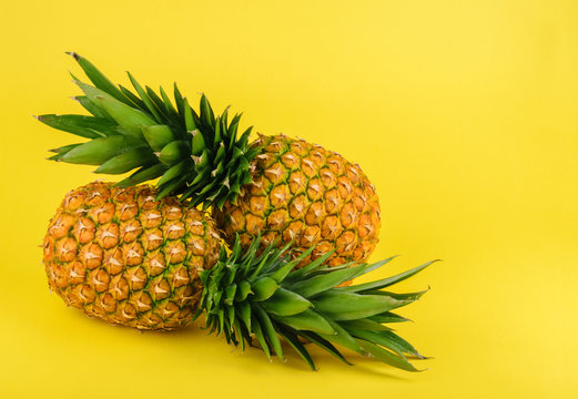 Pineapple on yellow background