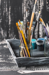 Artistic equipment.  Brushes and paints for drawing. Items for children's creativity.