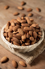 Almond snack fruit in white bowl on wooden