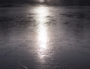 freshly frozen lake at sunset. background, seasonal.