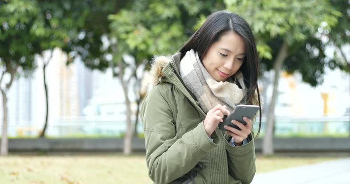 Woman using cellphone at outdoor