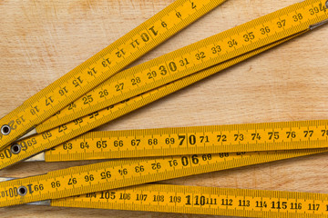 Measuring Stick on a Wooden Table