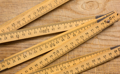 Measuring Stick on a Wooden Table