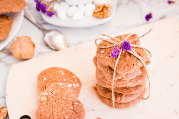 A stack of homemade chocolate cookies tied with a rope
