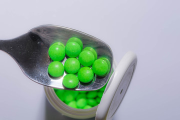 Pills in a spoon